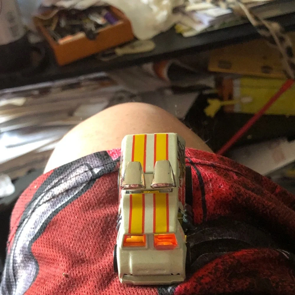 Vintage Toy Car with Yellow & Orange Racing Stripes